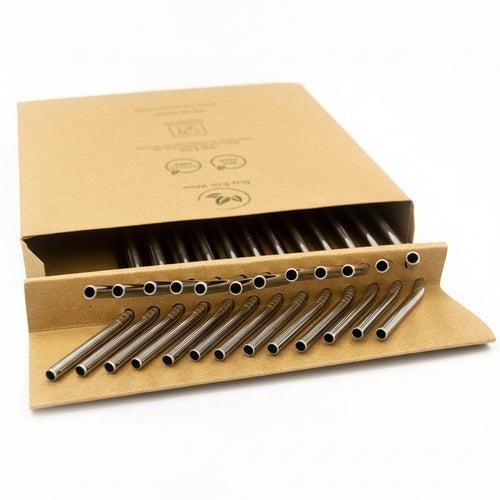 A set of stainless steel reusable straws arranged in a brown kraft paper sleeve with a matching lid, photographed on a white background.