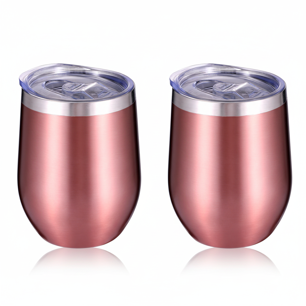 Two stainless steel stemless wine tumblers with a brushed rose gold finish and clear plastic lids, shown side by side on a white background with soft reflections below.