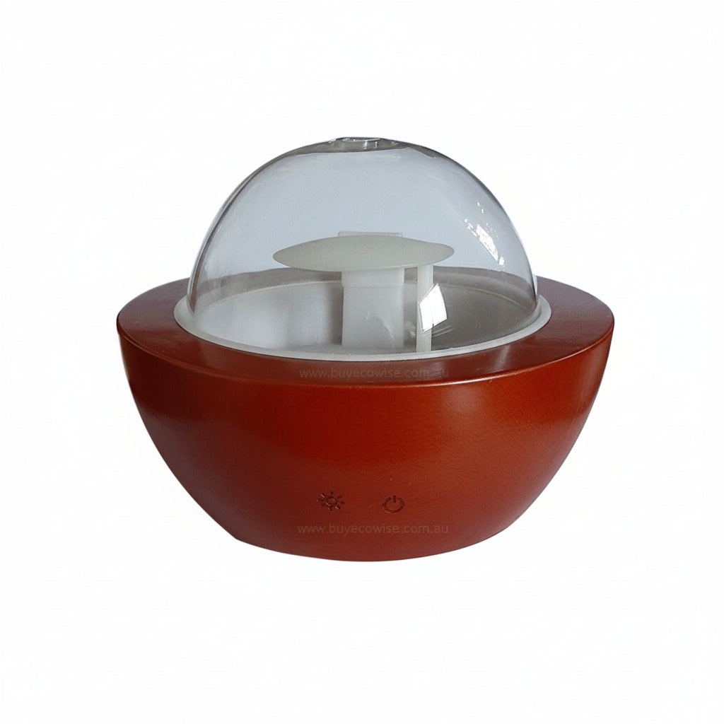 A small tabletop humidifier with a glossy reddish-brown base, a clear glass dome, and a white inner tray, shown on a plain white background.