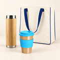 On-the-Go Eco Gift Set with bamboo bottle, blue reusable café mug and natural cotton tote